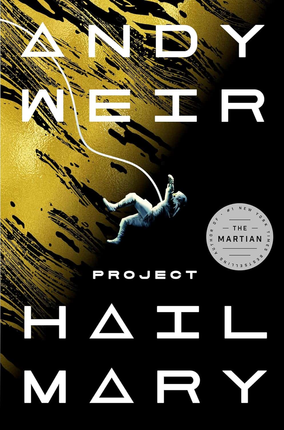 Book cover of Project Hail Mary by Andy Weir, perfect for any Holiday Gift Guide. It features an astronaut tumbling against a gold and black background with a round sticker mentioning The Martian and #1 New York Times Bestselling Author.