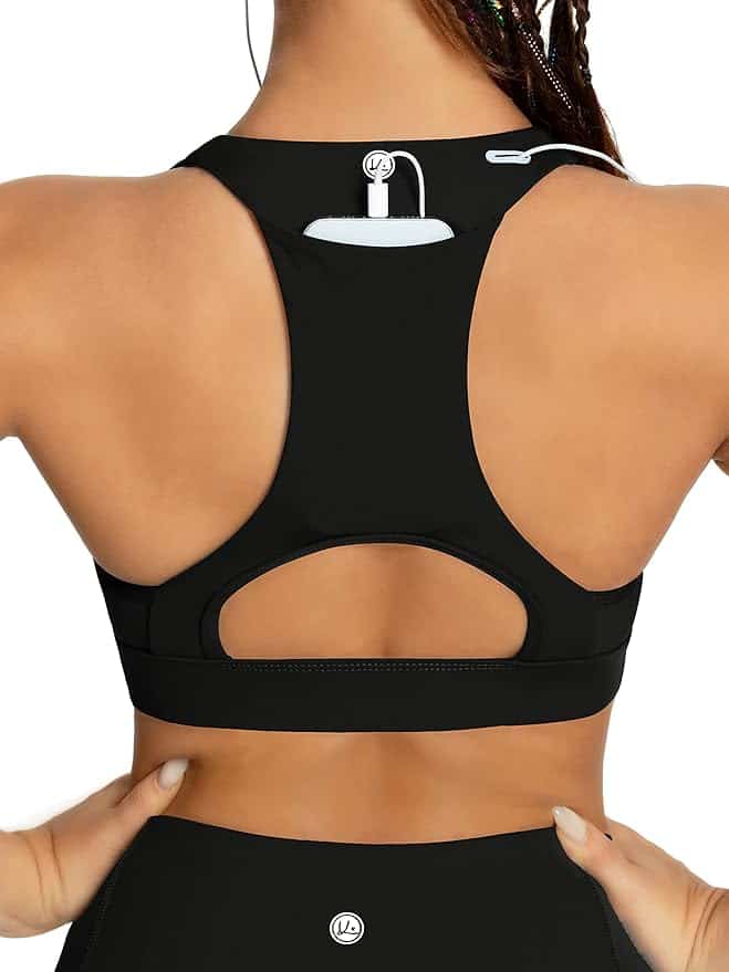 Back view of a person wearing a black sports bra with wired earphones tucked into the back strap. The strap has a small loop to hold the wires. A portion of the person's braided hair is visible.