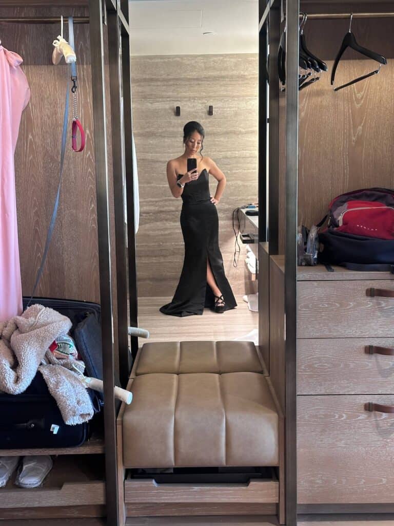Mental toughness: "Shifting the line" of your distress tolerance. 2 Joanne, in a black, floor-length gown takes a mirror selfie in a walk-in closet, surrounded by clothes and a suitcase.