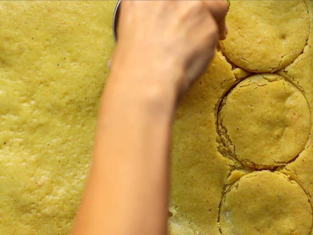 cutting out rounds in lemon cake for vegan strawberry shortcake trifle.