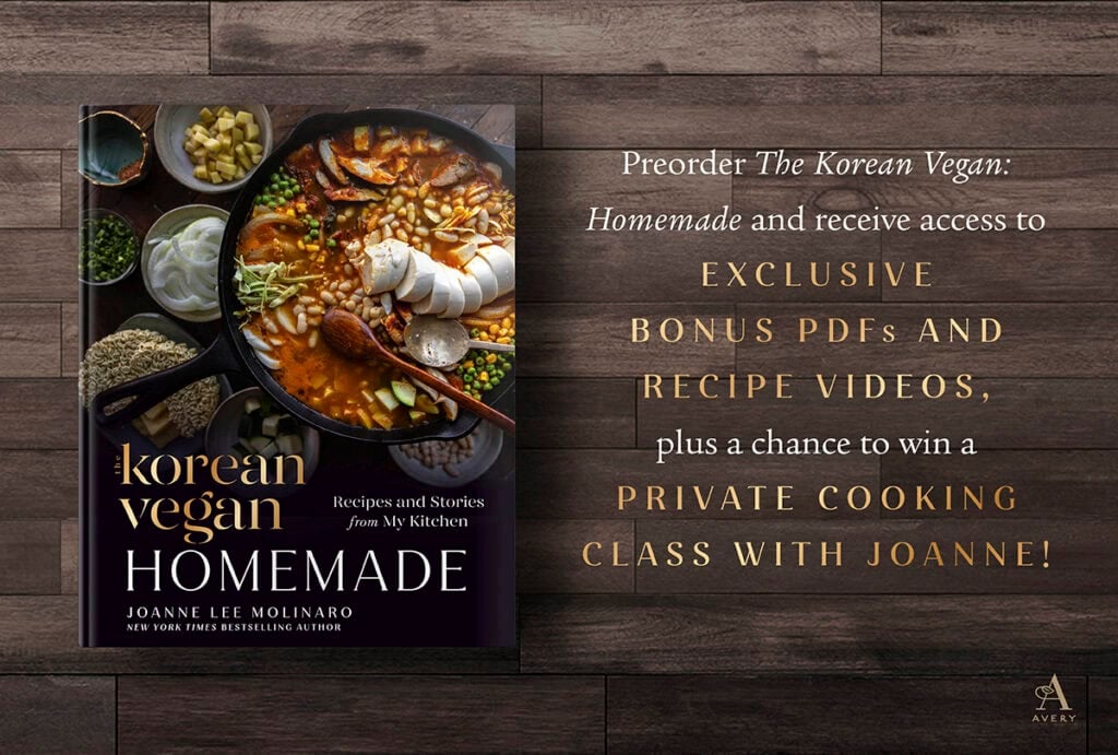 A cookbook titled Korean Vegan Homemade sits on a wooden table. Next to it, gold text promotes preorder rewards: exclusive PDFs, videos, and a chance to win a private cooking class with author Joanne Lee Molinaro.