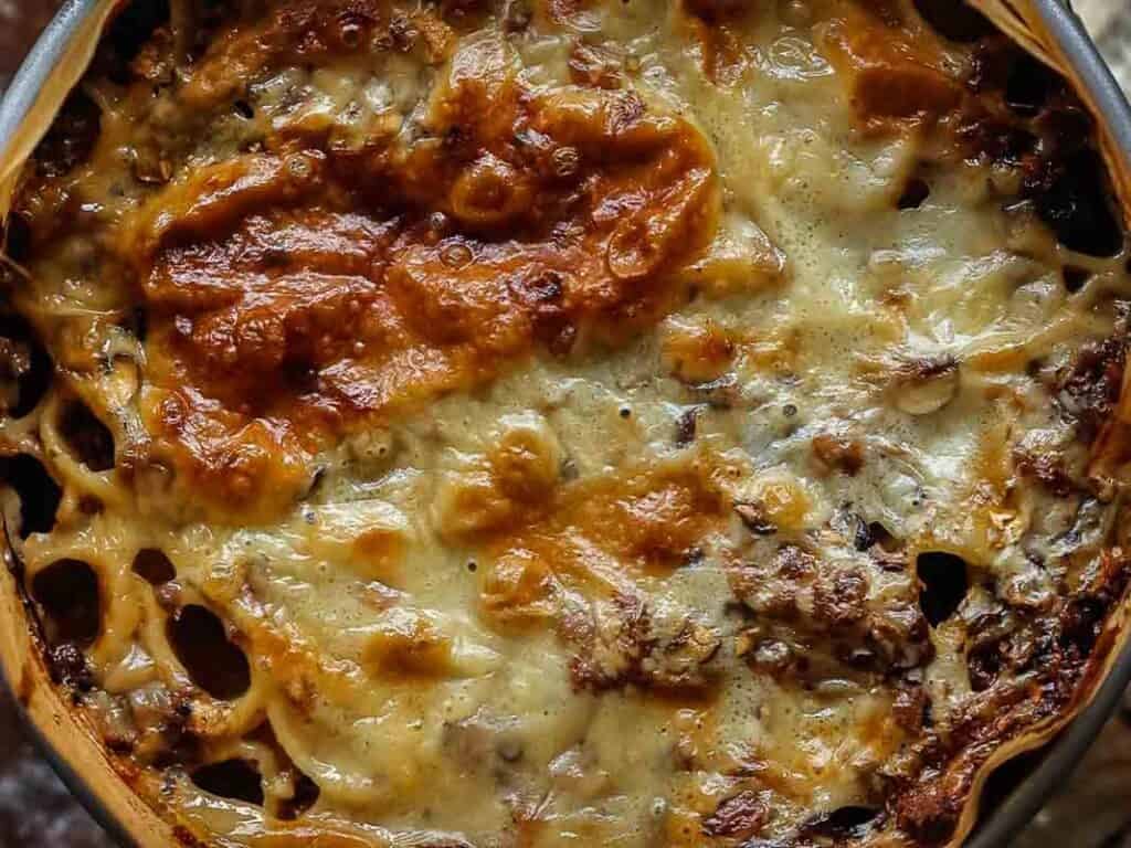 close up top down view of mushroom rigatoni pie.